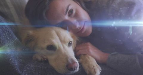Cozy Woman Cuddling Golden Dog on Comfortable Couch