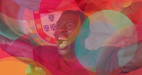 Passionate soccer fan celebrating portugal national team