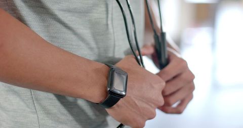 Preparing for Workout with Jump Rope and Smartwatch - Download Free Stock Images Pikwizard.com