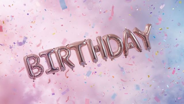 Rose-gold birthday balloon letters floating over pastel confetti and clouds