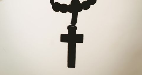Rosary Silhouette on Minimalist Beige Background - Download Free Stock Images Pikwizard.com