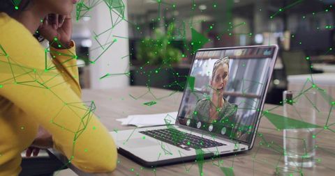 Connecting teams through virtual meeting on laptop in modern coworking workspace and remote teamwork