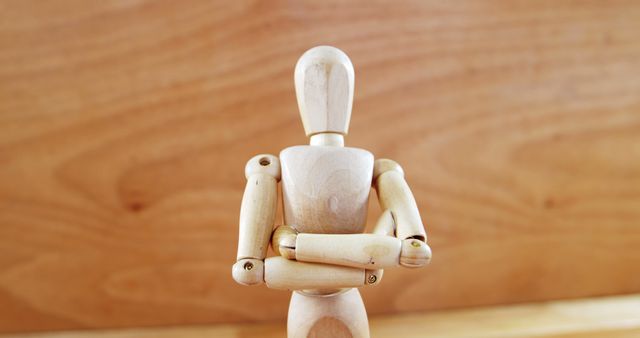 Wooden Art Mannequin With Arms Crossed in Thoughtful Pose - Download Free Stock Images Pikwizard.com