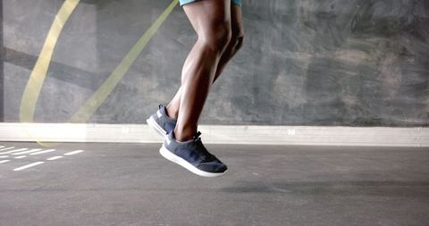 Man jumping rope in gym enhancing agility and fitness