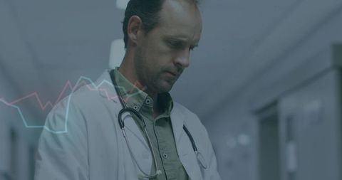 Doctor with Stethoscope Analyzing Patient Data in Hospital Corridor