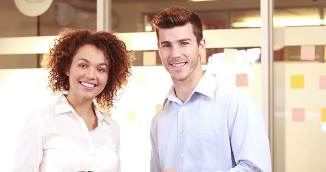 Diverse Colleagues Smiling at Office with Post-it Notes - Download Free Stock Images Pikwizard.com