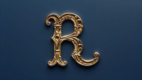 Ornate Metallic Gold Letter R with Elegant Scrollwork