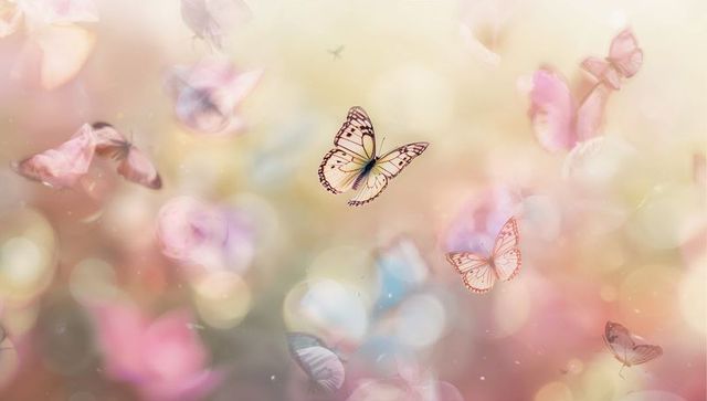 Dreamy pastel butterflies fluttering over bokeh garden with sparkles