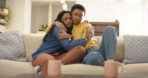Mother and Daughter Comforting Each Other With a Warm Embrace
