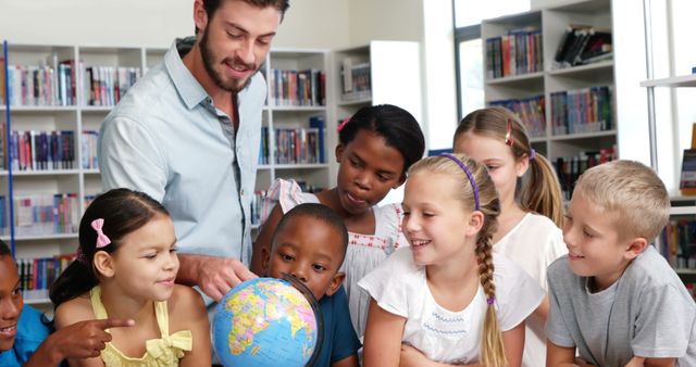 Teacher Showing Diverse Children Globe in Library Classroom - Download Free Stock Images Pikwizard.com