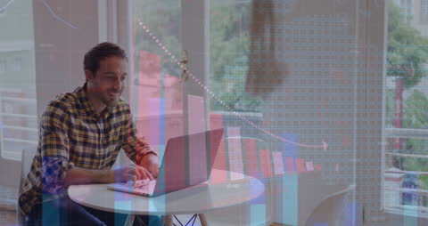 Businessman Analyzing Data on Laptop with Digital Graph Display