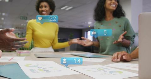 Team collaborating on analytics and social engagement visuals in modern office