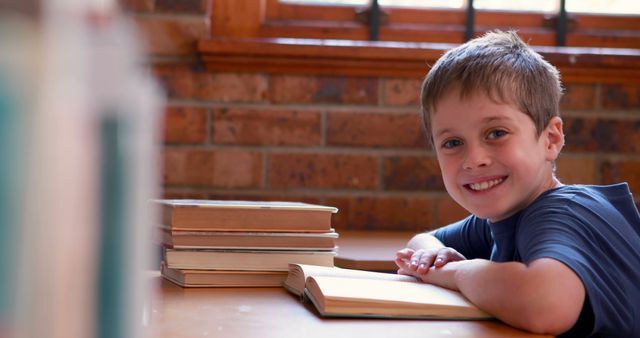 Smiling Young Boy Reading Book in Cozy Room - Download Free Stock Images Pikwizard.com