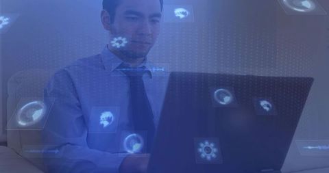 Businessman working on laptop with holographic data interface and glowing blue tech overlays