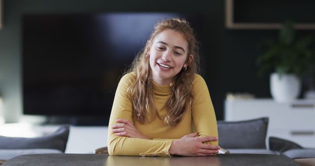 Young Woman Laughing in Modern Living Room, Relaxed Atmosphere - Download Free Stock Images Pikwizard.com