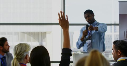 Business seminar speaker engaging interactive audience participation