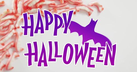 Happy Halloween Text with Purple Bat and Candy Background