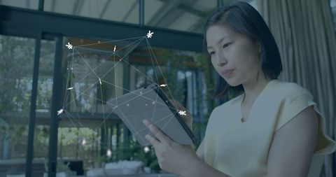 Woman utilizing tablet with digital currency integration