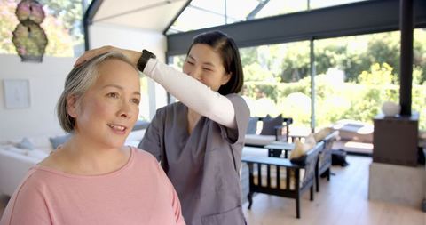 Physiotherapist Assisting Senior Woman with Head Exercise - Download Free Stock Images Pikwizard.com