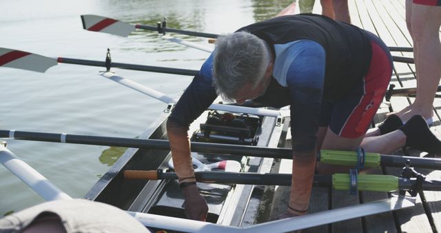 Rowers Preparing Boat on Lake Dock for Practice - Download Free Stock Images Pikwizard.com