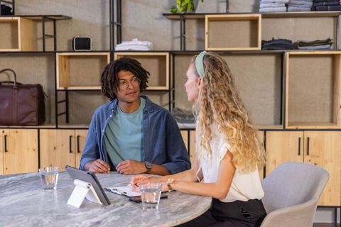 Collaborating Coworkers in Modern Office Discussing Project Details