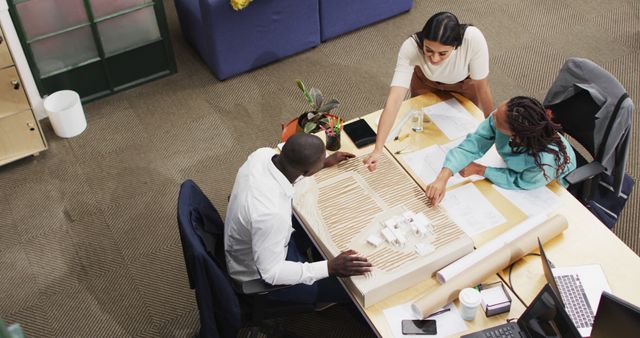 Team Collaborating on Architecture Model in Modern Office - Download Free Stock Images Pikwizard.com