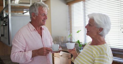 Senior Couple Enjoying Morning Coffee in Modern Kitchen - Download Free Stock Images Pikwizard.com