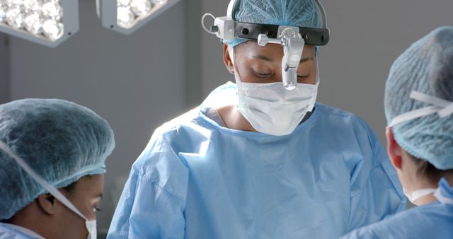 Surgeons performing surgery in operating room with focus - Download Free Stock Images Pikwizard.com