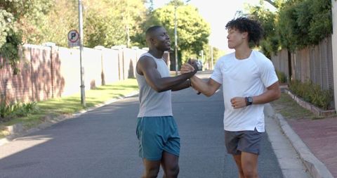 Diverse Male Runners Celebrating Friendship After Workout