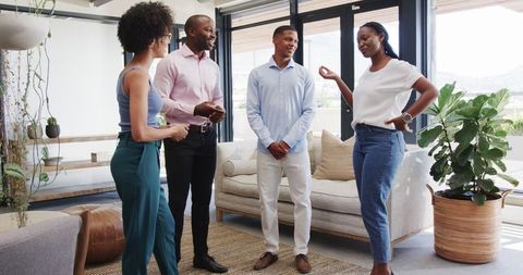 Colleagues engaging office discussion, teamwork collaboration vibes