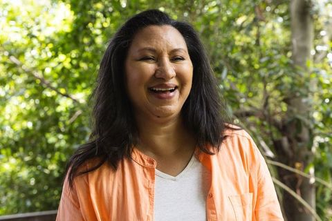 Smiling Woman Enjoying Sunny Outdoor Environment