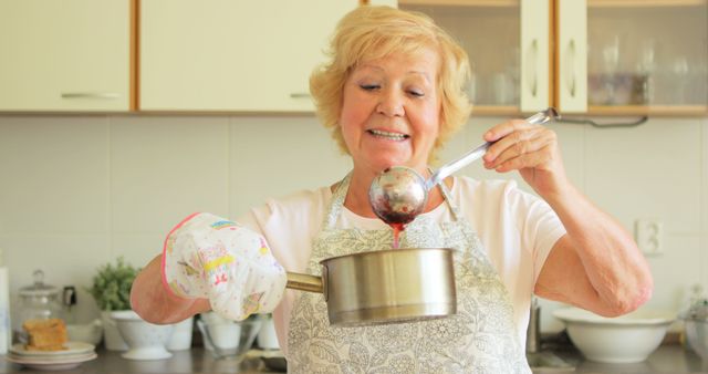 Senior Woman Cooking in Kitchen Pouring Soup - Download Free Stock Images Pikwizard.com