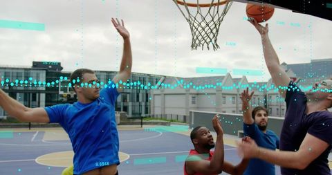 Athletes Engaged in Urban Basketball Game with Motion Tracking
