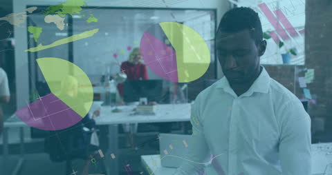 Businessman Analyzing Data with Tablet Amidst Office Technology