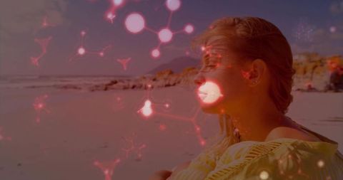 Contemplative Woman on Beach with Digital Network Overlay