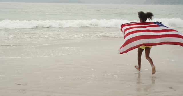 Child Running on Beach with American Flag - Download Free Stock Images Pikwizard.com