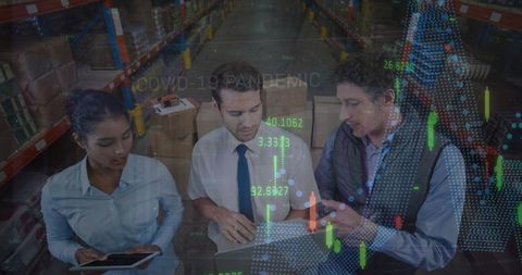 Warehouse Workers Analyzing Data Trends for Planning and Logistics