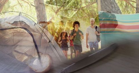 Friends Exploring Forest with Backpacks on Outdoor Adventure Trip