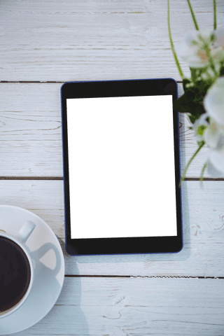 tablet and coffee on light wooden table with transparent background - Download Free Stock Videos Pikwizard.com