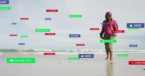 Senior man on wet sand holding phone with floating social media badges and messages