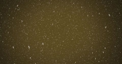 Falling snowflakes on brown background creating winter elegance