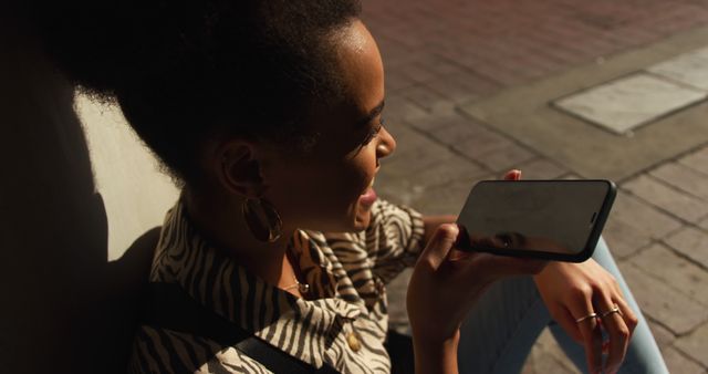 Woman Talking on Smartphone on Street in Sunlight - Download Free Stock Images Pikwizard.com