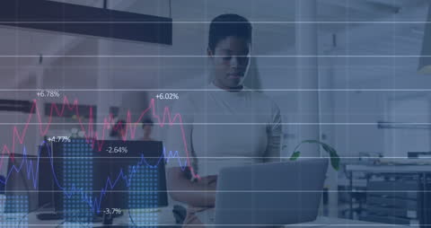 Professional Analyzing Financial Data on Laptop in Modern Office