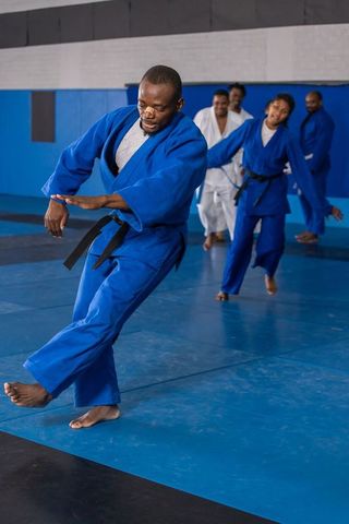 Martial arts class movement led by talented instructor