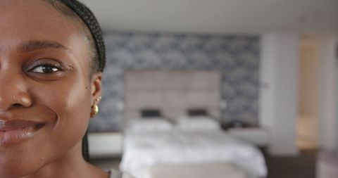 Happy Woman Posing in Elegantly Designed Bedroom Interior