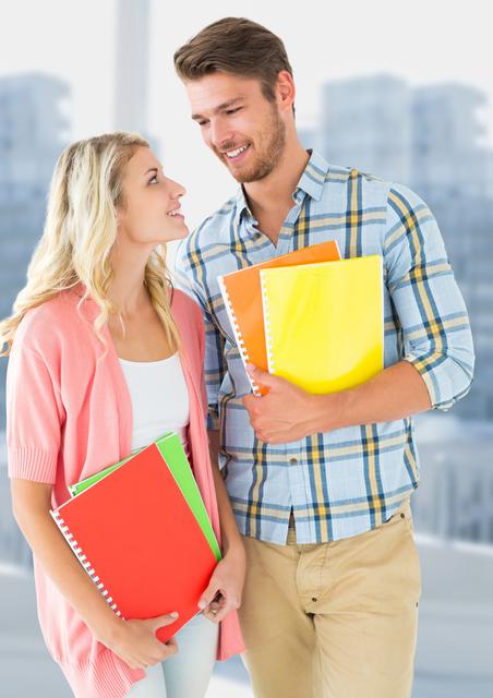 Two teenage students standing together, holding colorful notebooks and smiling. They are wearing casual clothing and seem happy and engaged. This image is perfect for educational content, school promotions, youth-oriented advertisements, and articles related to student life, learning, and friendships.