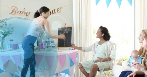 Expectant mother celebrating baby shower at home with friends, gender reveal fun