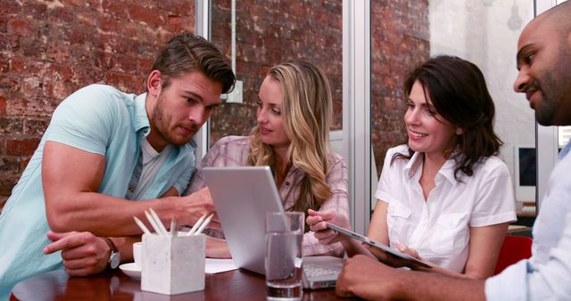 Young Professionals Collaborating on Tablet and Laptop in Modern Office - Download Free Stock Images Pikwizard.com