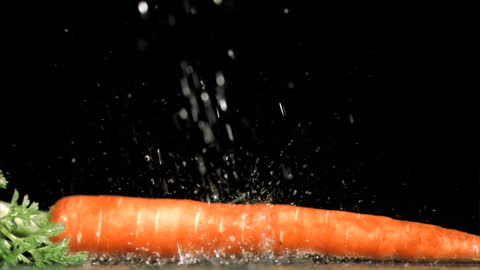 Water Splash on Vibrant Carrot Highlighting Freshness