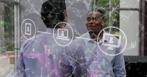 Coworkers Discussing in Tech-Driven Office Environment